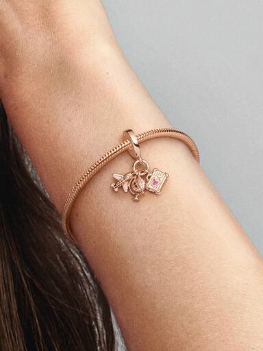 Airplane, globe and suitcase 14k rose gold-plated dangle with pink enamel