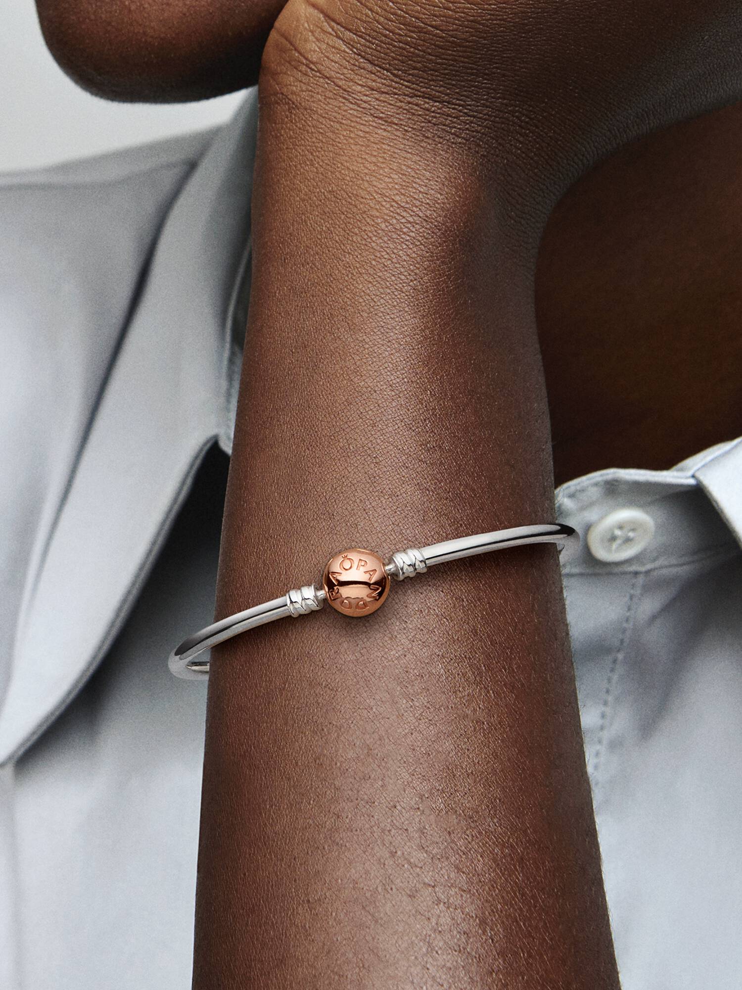 Silver bangle with 14k rose gold-plated clasp